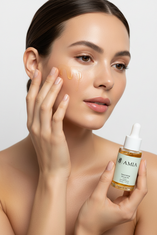 Woman applying a skincare product to her face with a bottle of AMIA skincare oil in the foreground.